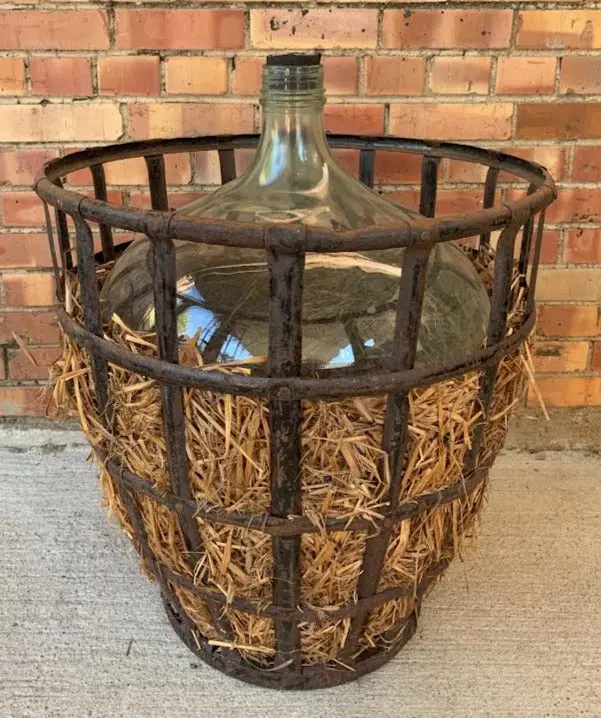 Huge Wine Bottle In Iron Basket 1