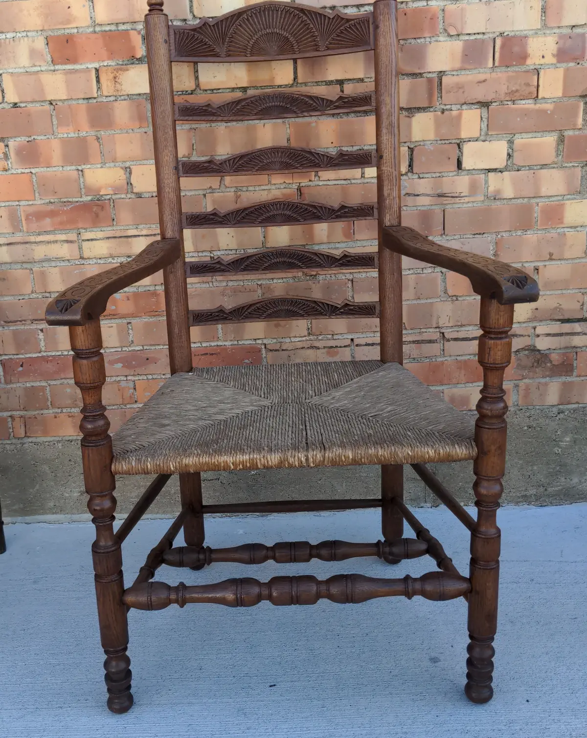 Large Chip Carved Oak Ladder Back Armchair With Rush Seat And Pegs 1