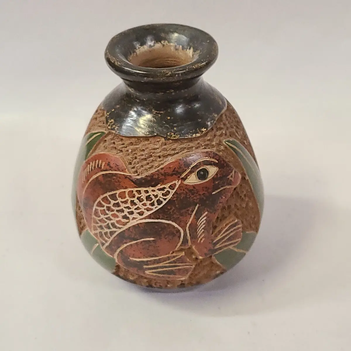 Carved Pottery Jar With Decor 1