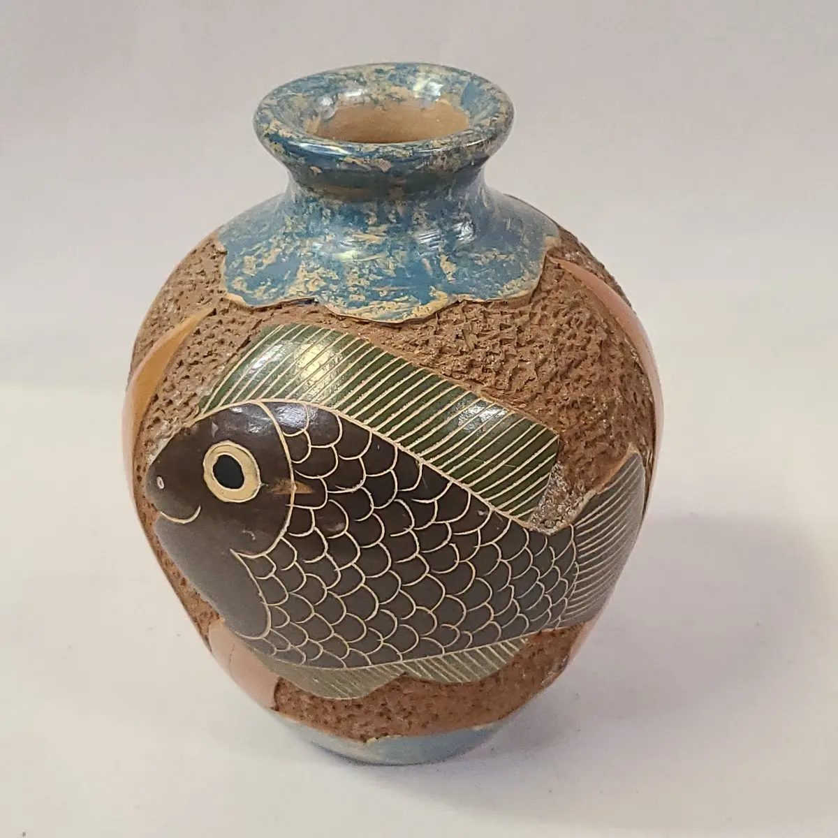 Carved Pottery Jar With Fish Decor 1