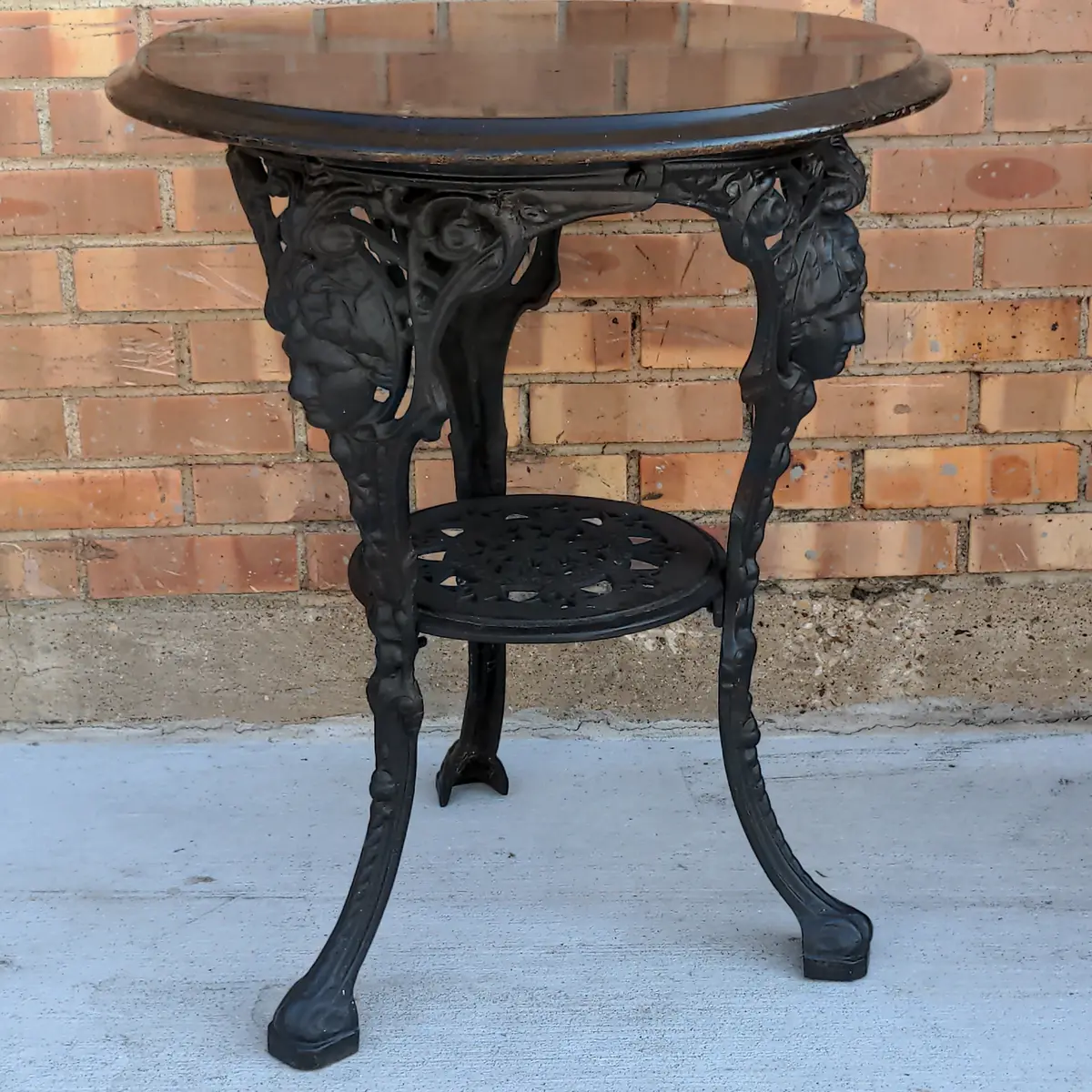 Black Painted Mahogany Top Cast Iron Pub Table With Figural Masks 1