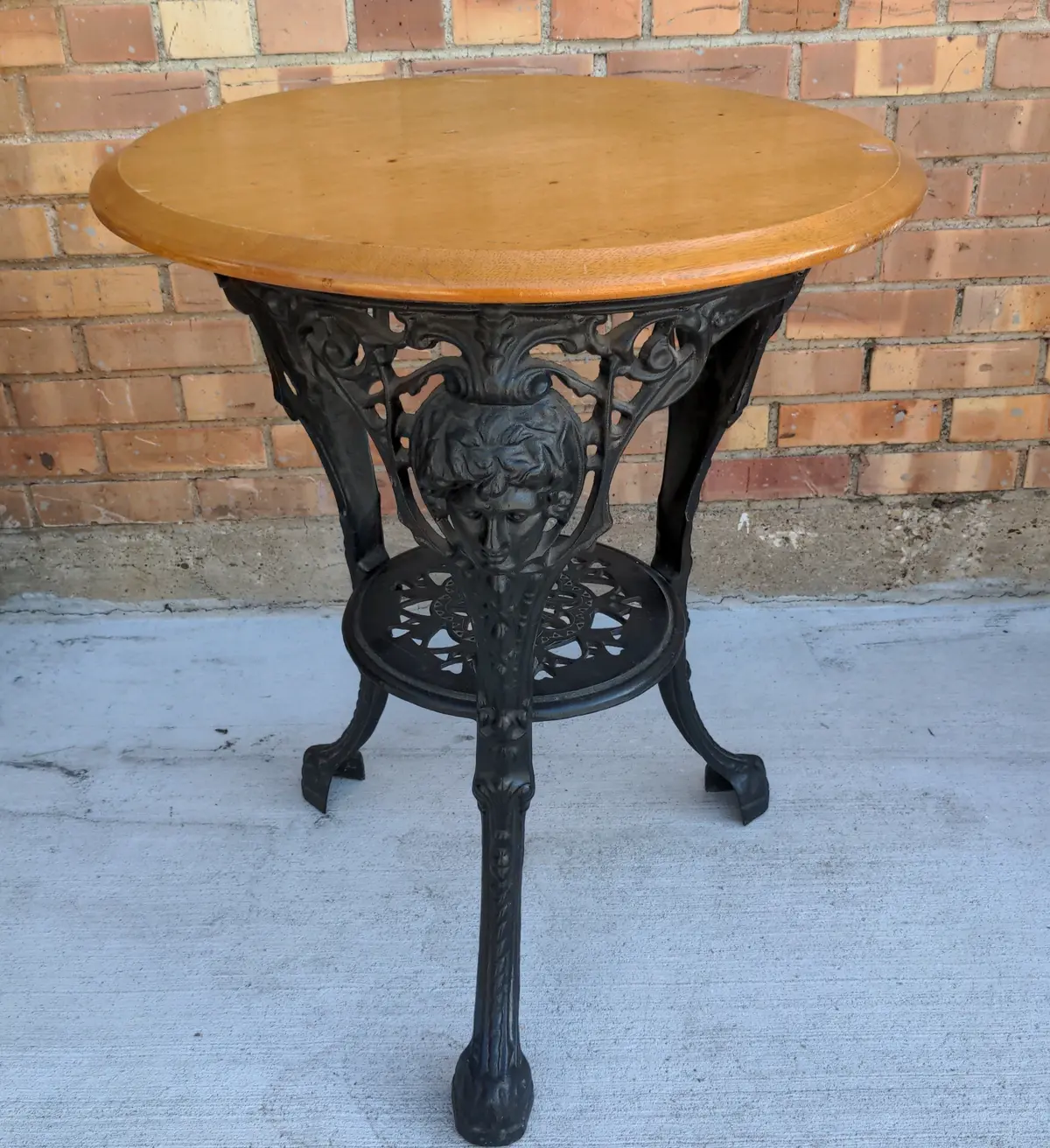 Light Mahogany Top Cast Iron Pub Table With Figural Masks 1