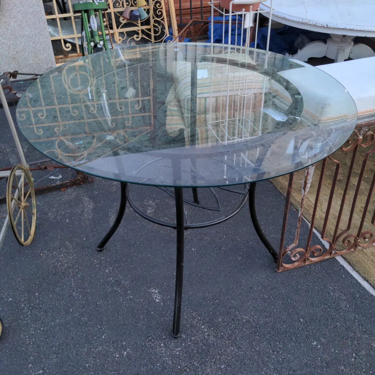 Outside Glass-Top Table With Black Metal Base 1