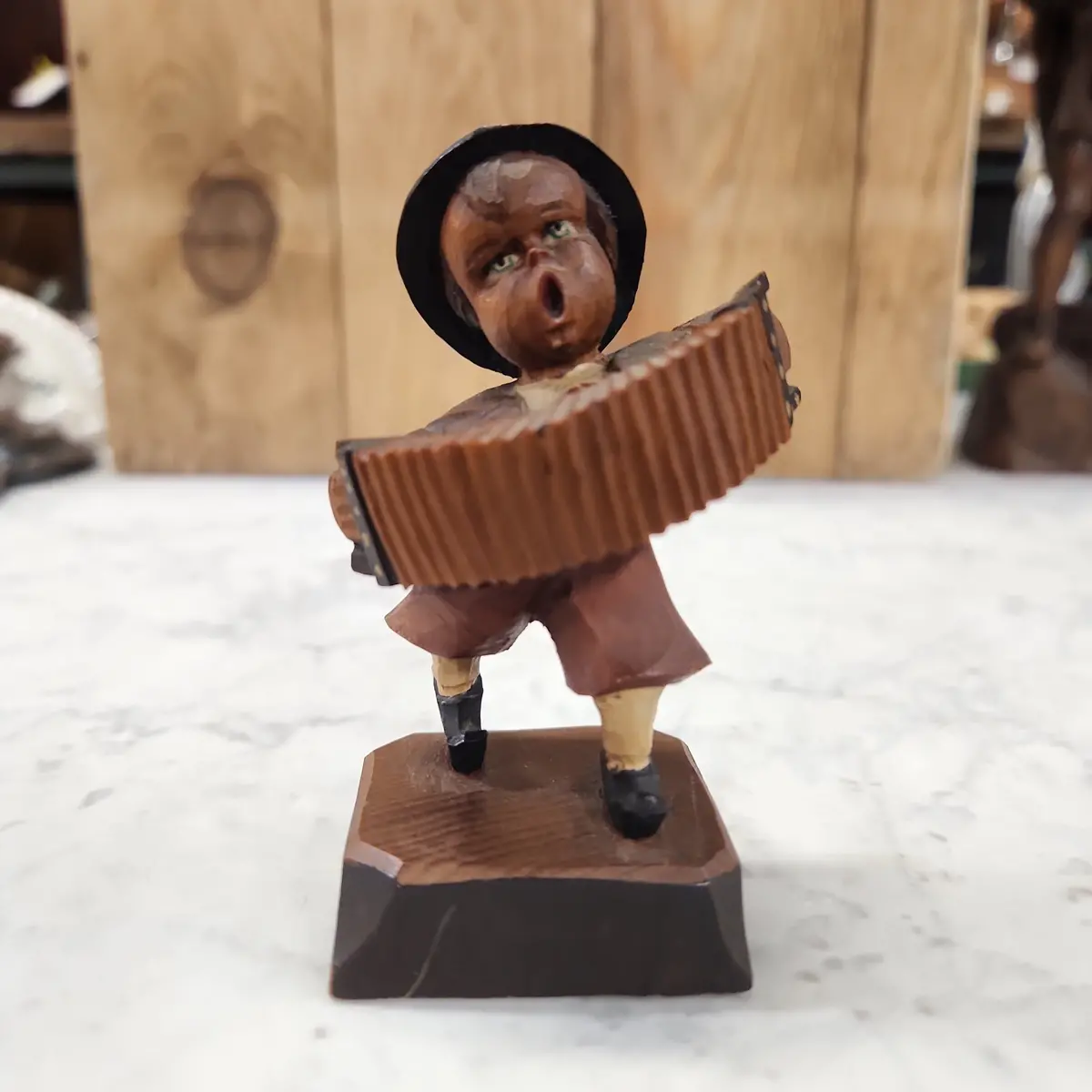 Wood Carving Of An Accordian Player Boy 1