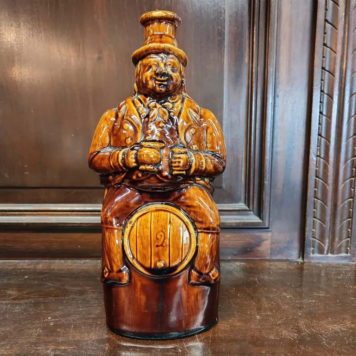 Man On Barrel Pottery Bottle 1