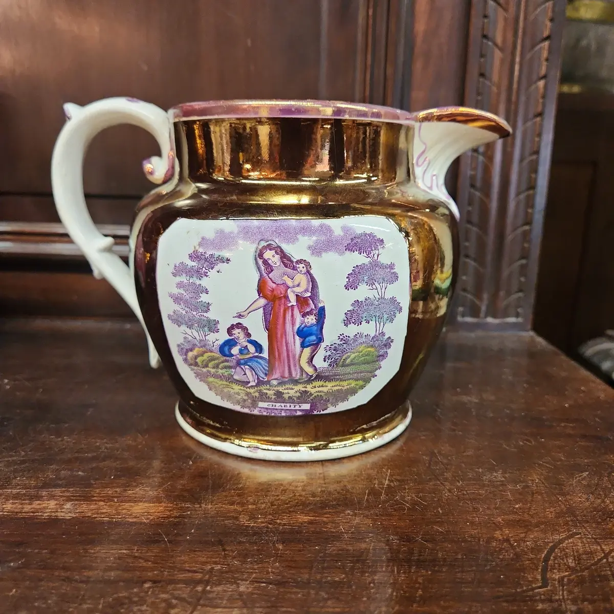 Large Luster Pitcher With Family 1