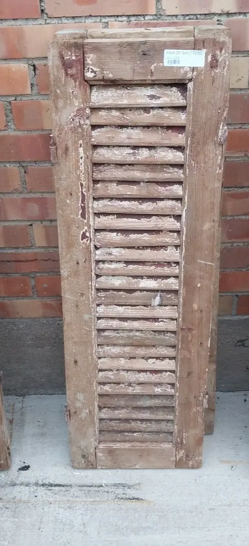 Pair Of Distressed Shutters With Brown Paint 1