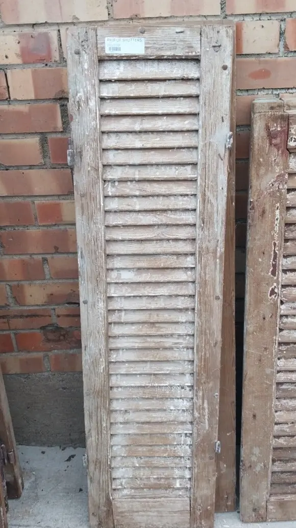 Pair Of Distressed Shutters With Brown Paint 1