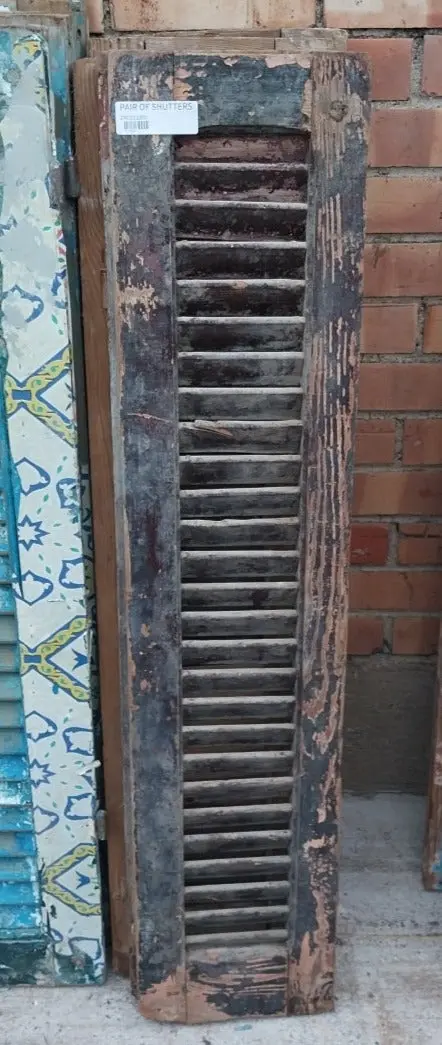 Pair Of Distressed Shutters With Brown Paint 1