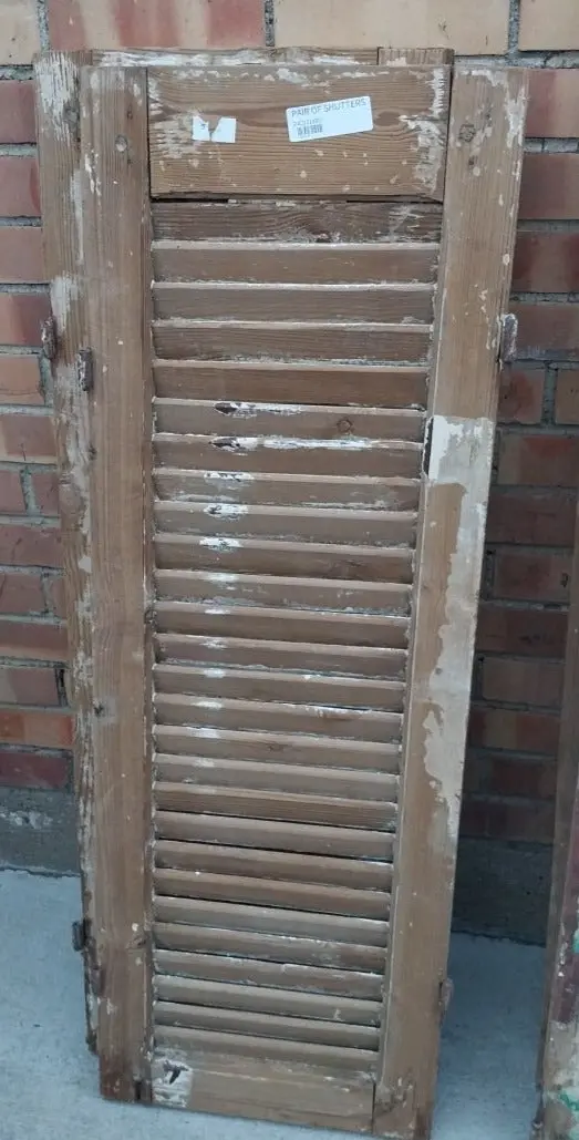Pair Of Distressed Shutters With Brown Paint 1