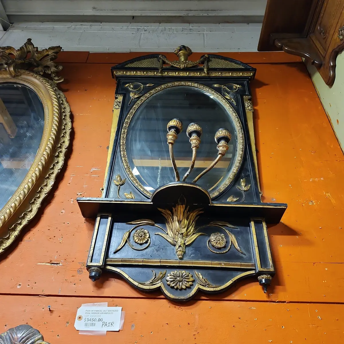 Pair Of Parcel Gilt Ebonized Oval Mirror Girandoles 1