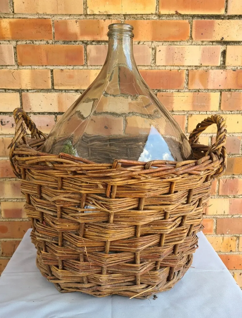 Large Wine Bottle In Basket 1