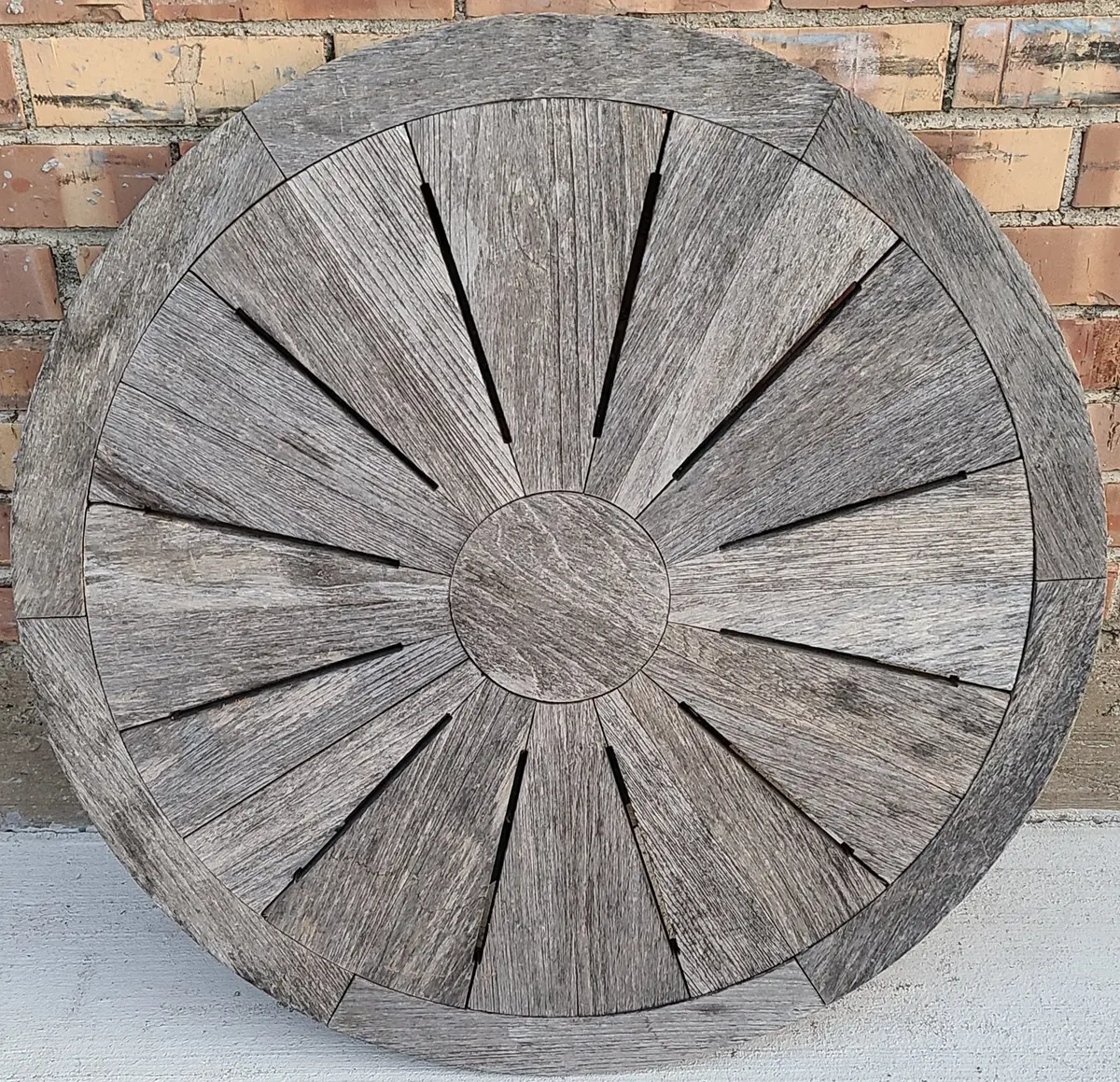 Cool Round Weathered Table Top Made Of Strips Of Pie Shaped Wood 1