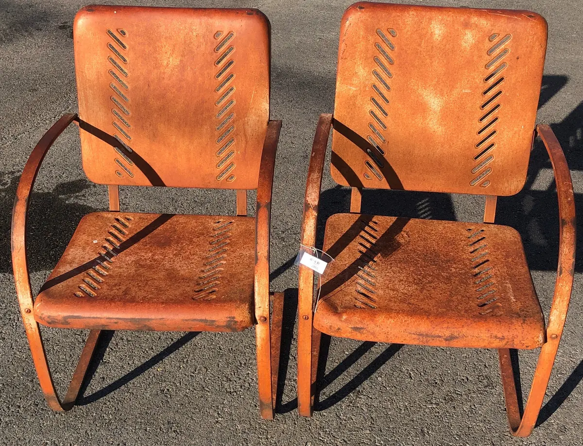 Pair Of Rust Colored Rocking Pierced Metal Chairs 1