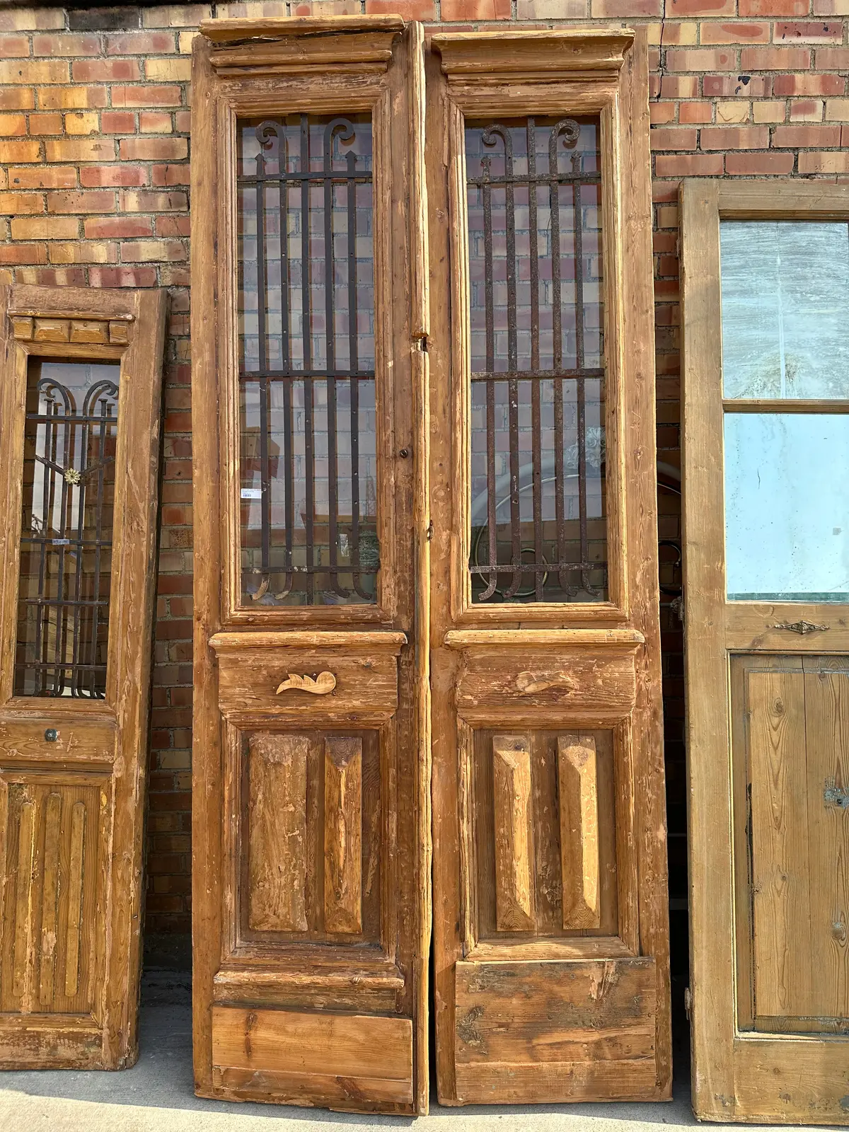 Pair Of Tall Slender Egyptian Primitive Iron Inset Wood Doors With Pyramodal Blocks 1