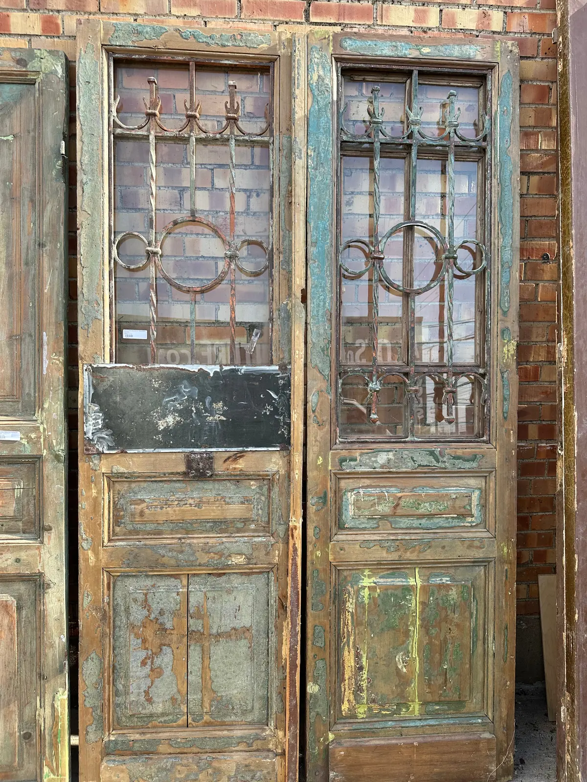 Pair Of Green Distressed Egyptian Iron Inset Wood Doors 1