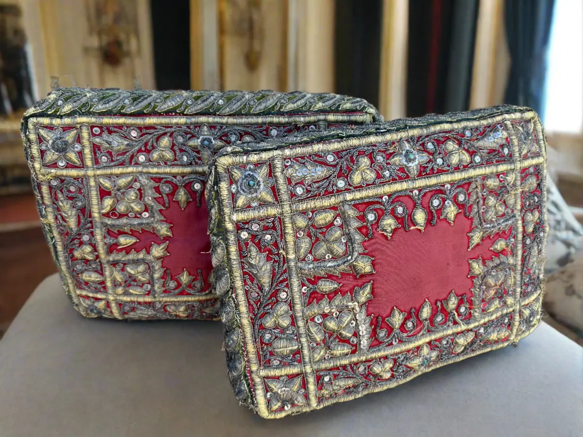 Pair Of Red Pillows With Gold Decorative Stitches 1