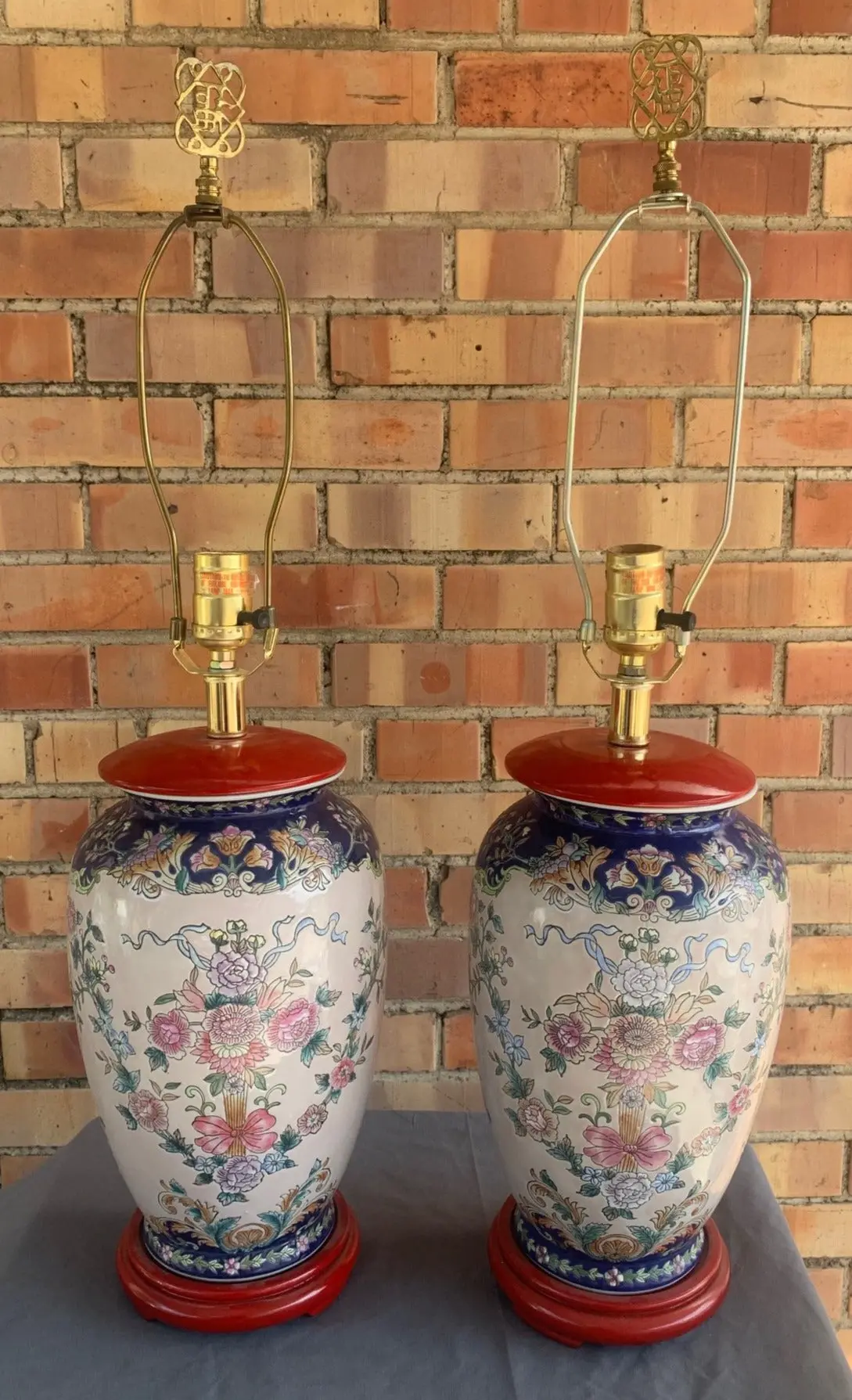 Pair Of Asian Pottery Lamps With Red Bases 1