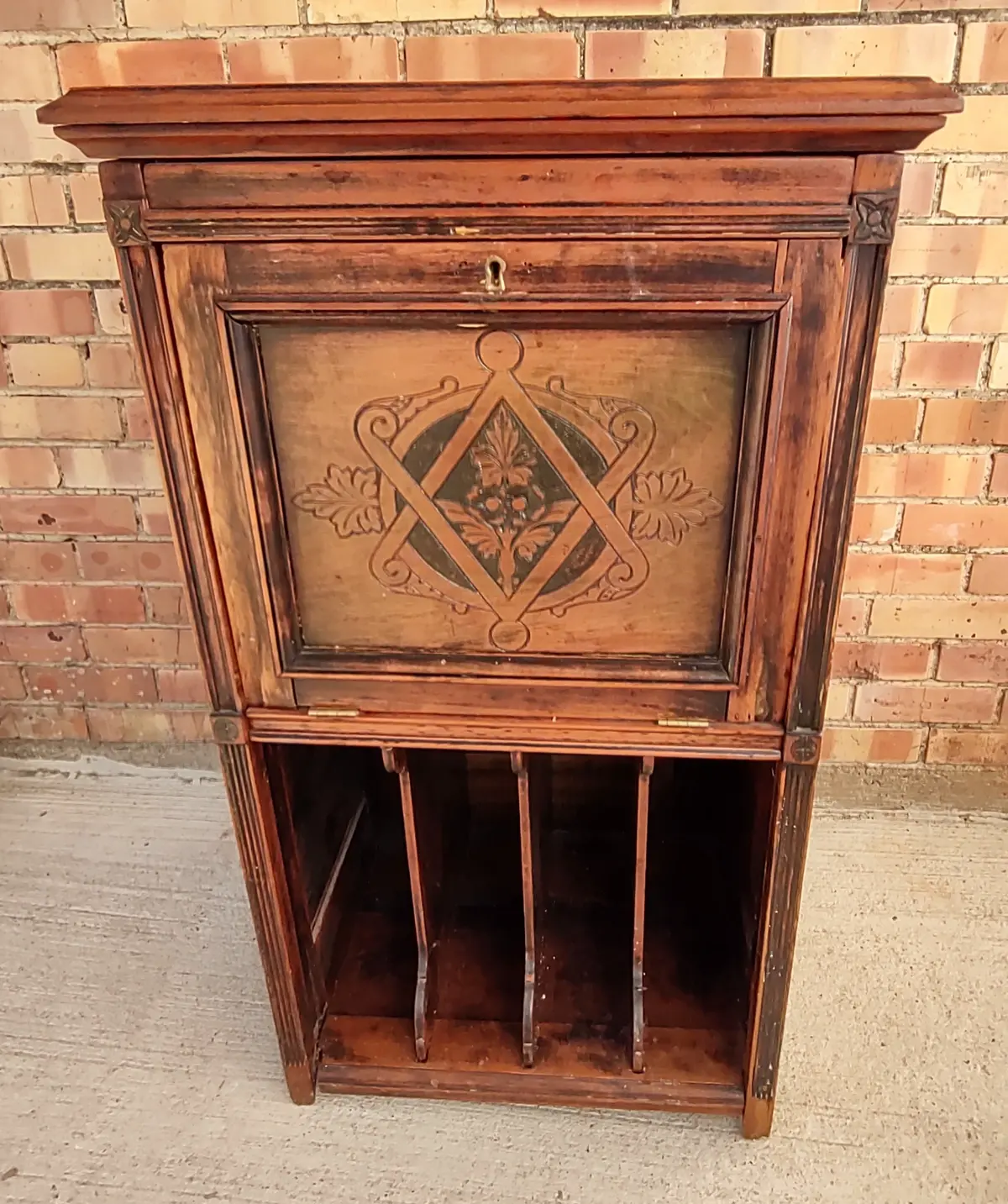 Small Cabinet With Carved Dropfront Door And File Slots 1