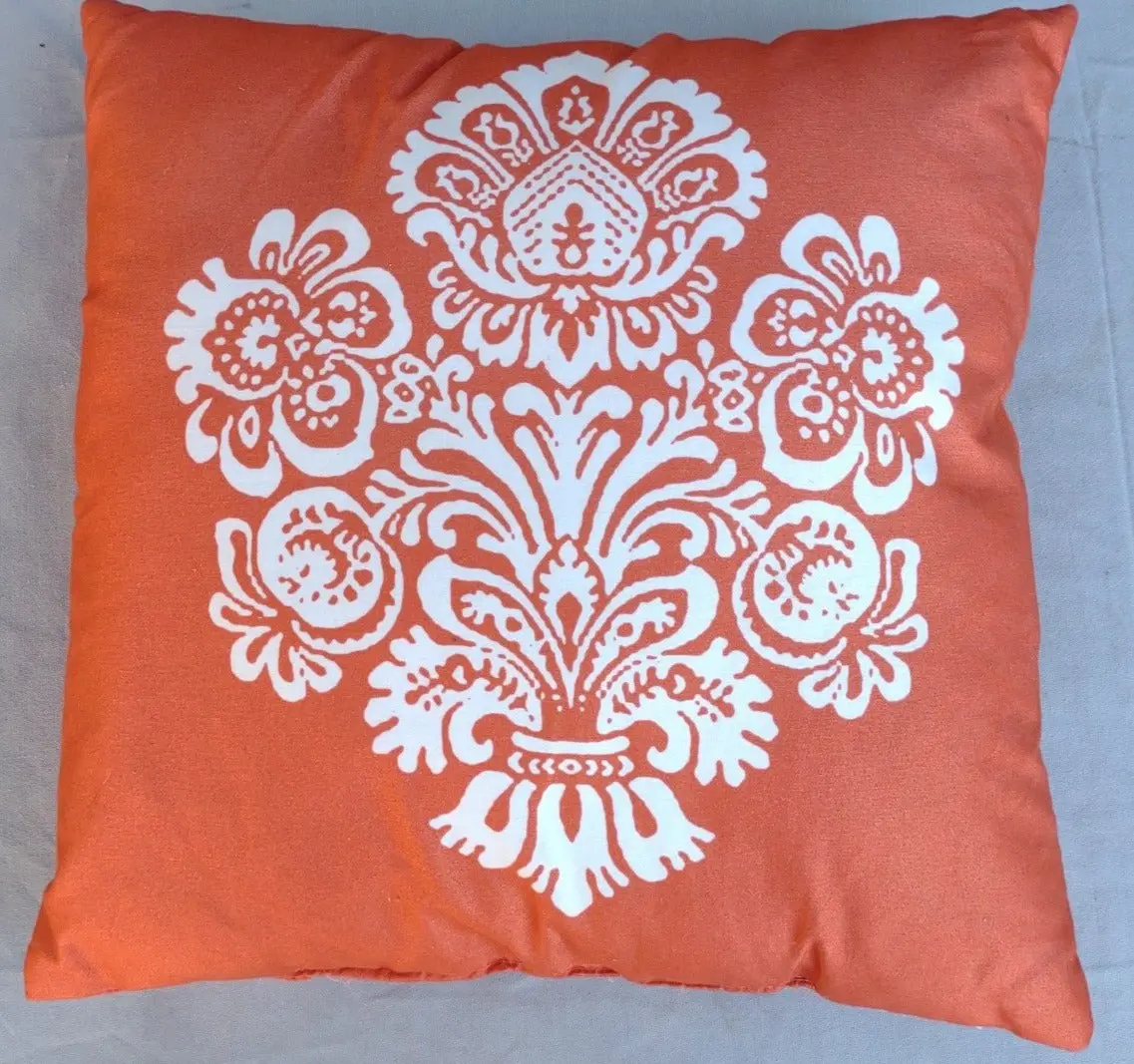 Orange Pillow With White Design 1