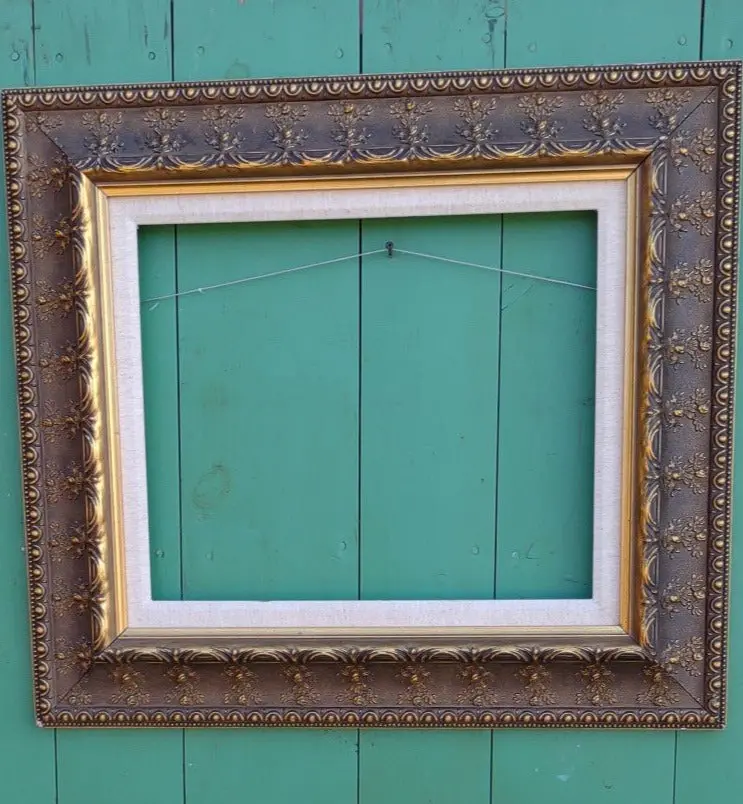 Ornate Gold Frame With Floral Motif And Linen Liner 1