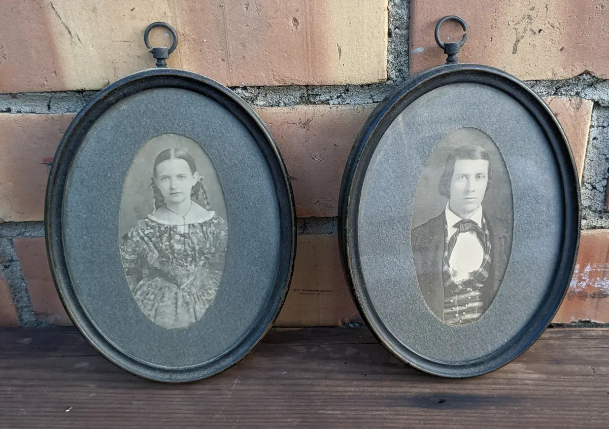 Pair Of Tiny Portraits In Oval Metal Frames 1