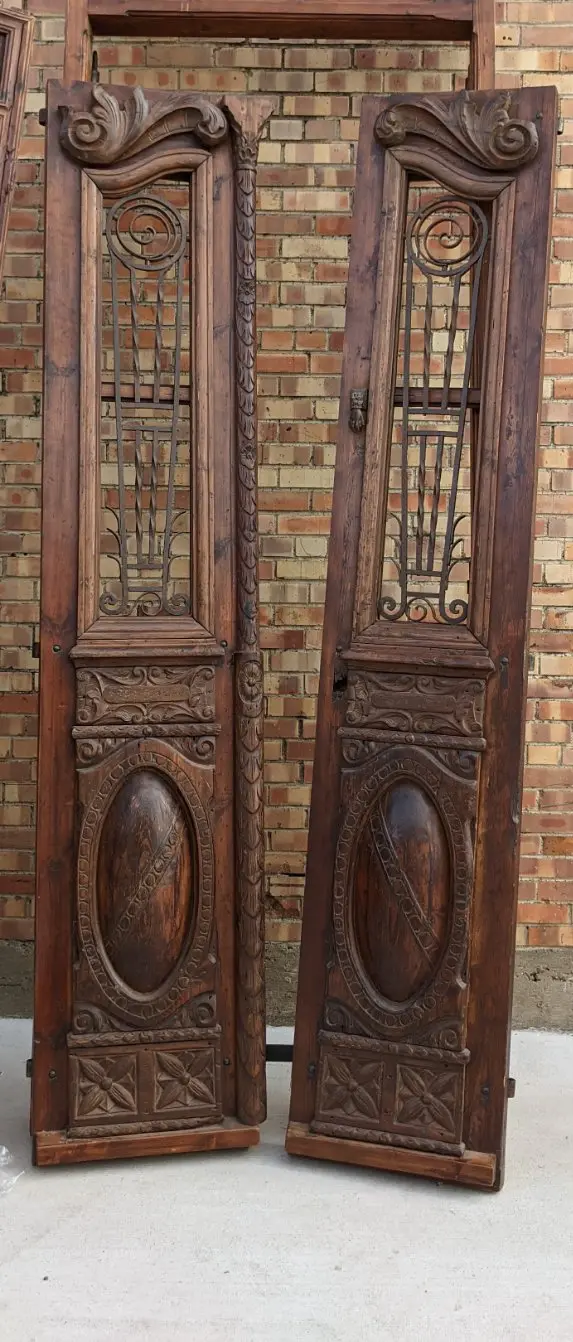 Pair Of Tall Carved Doors With Iron Insets In Frame 1