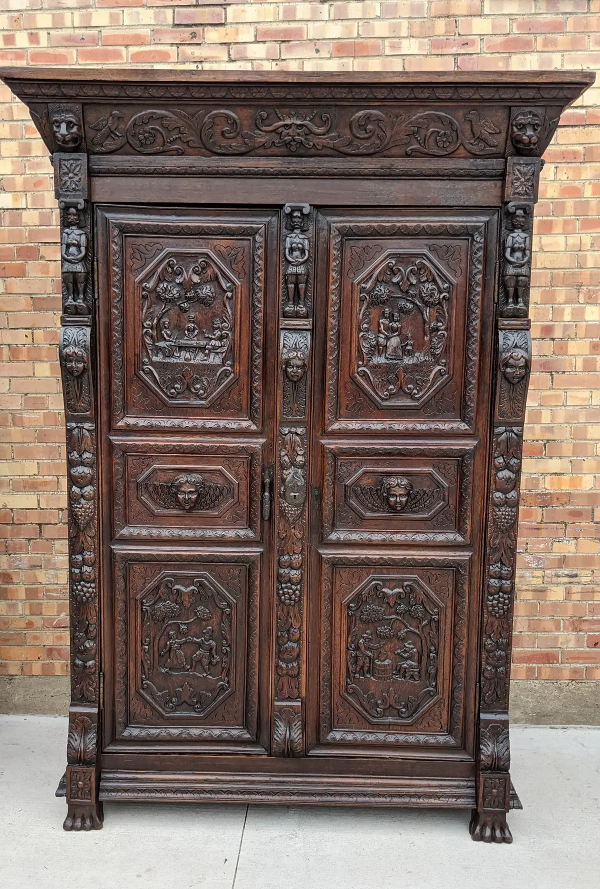 Ornately Carved Armoire With Paw Feet 1