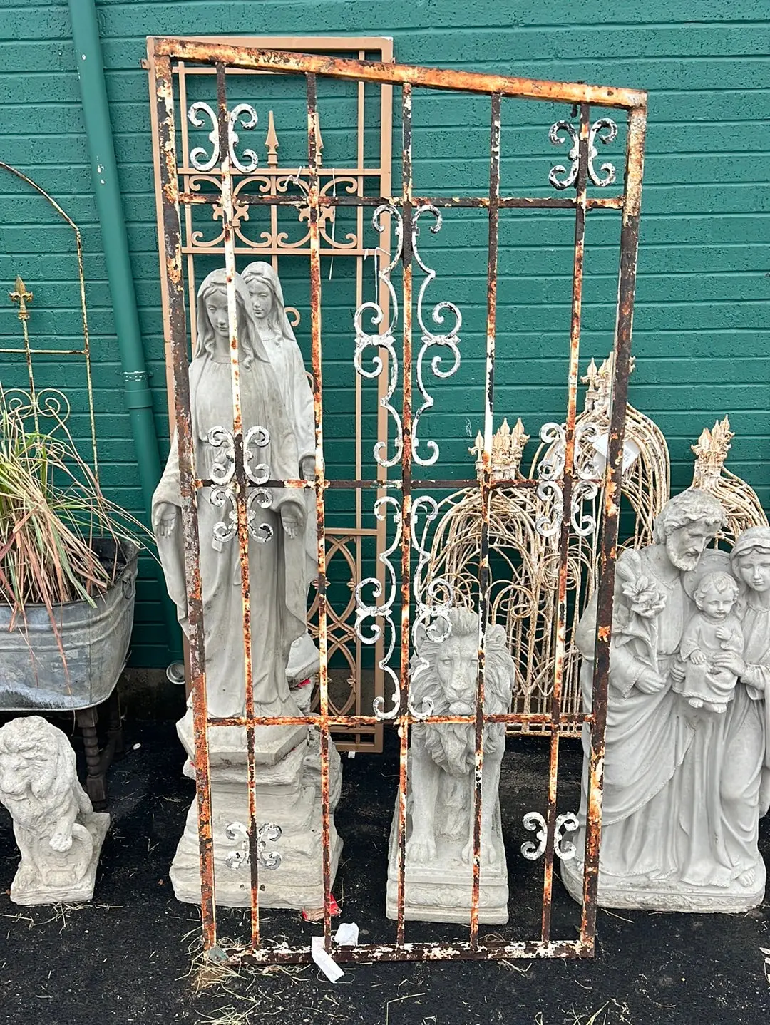 Tall Iron Gate With Slanted Top And Aluminum Applique 1