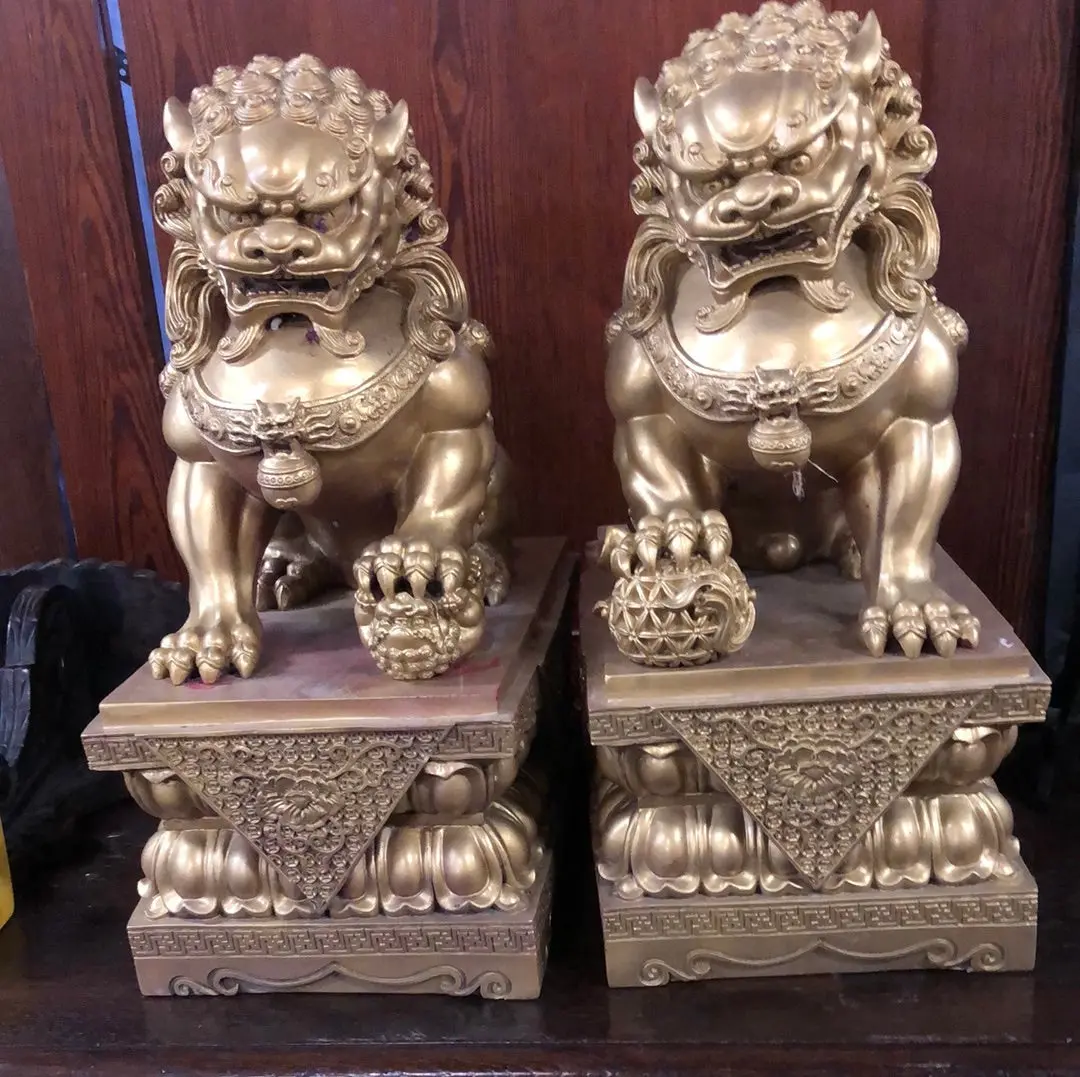 Pair Of Gilt Foo Dog Sculptures On Stands 1
