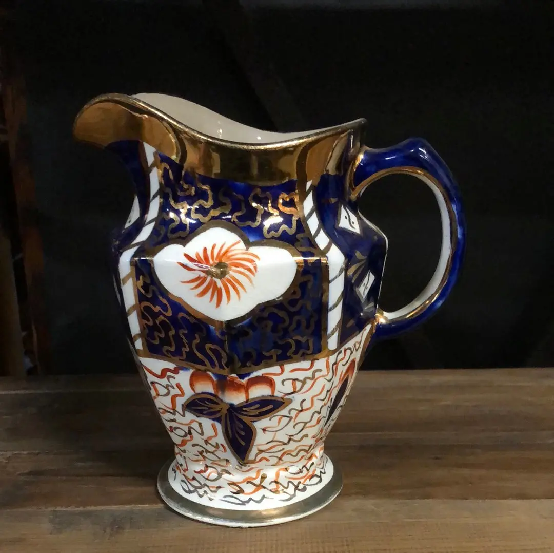 Gaudy Welch Orange And Blue Pitcher 1