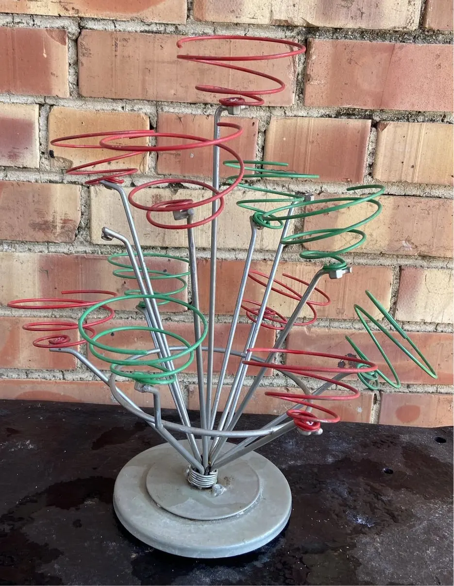 Sculptural Oddity Adourned With Colorful Springs 1