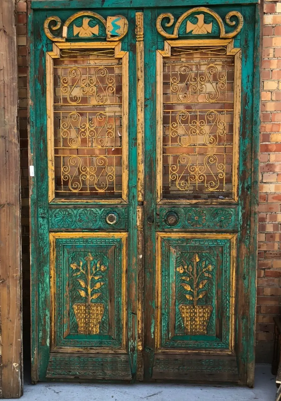 Pair Of Large Green Doors With Potted Plant 1