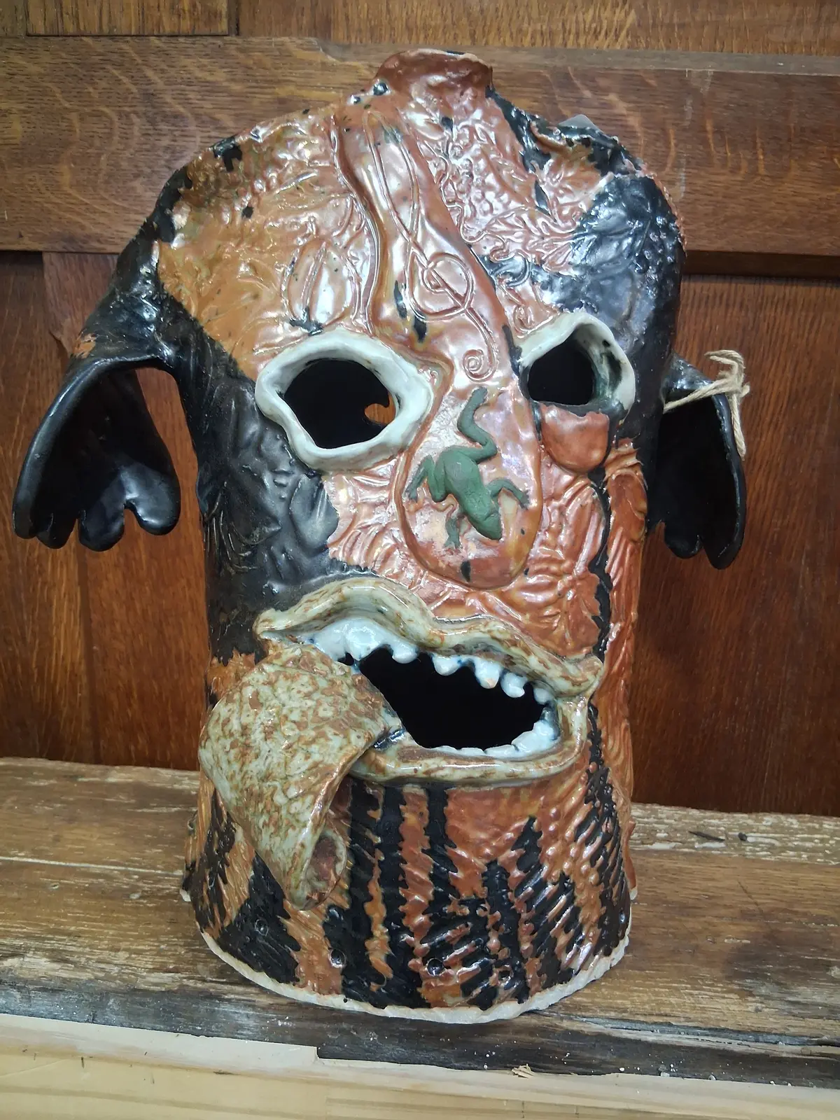 Brown Pottery Head With Pink Tongue And Blue Eyes By Terri Wilder 1