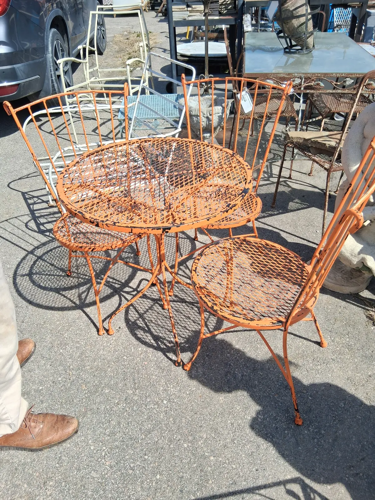Orange Metal Round Mesh Top Table With 3 Chairs 1